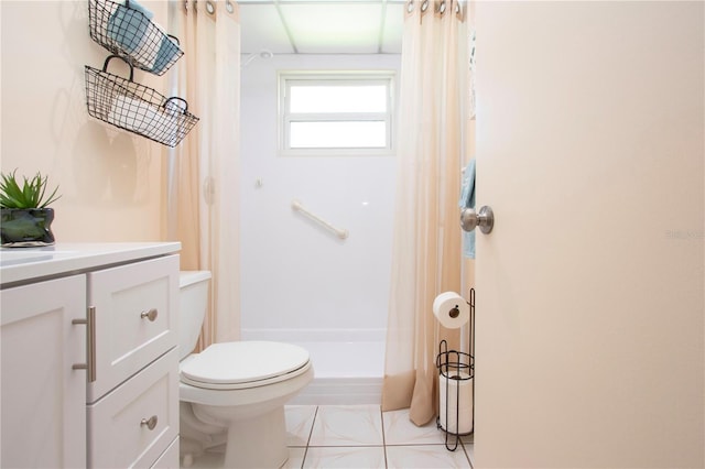 bathroom with vanity, toilet, a shower stall, and tile patterned flooring