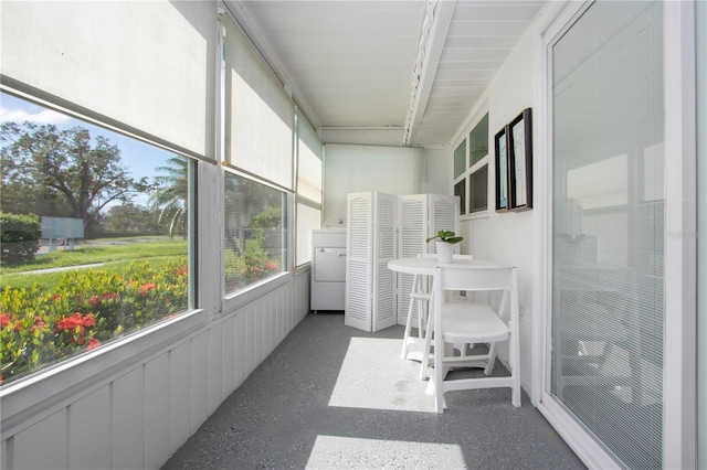 sunroom / solarium featuring washer / dryer