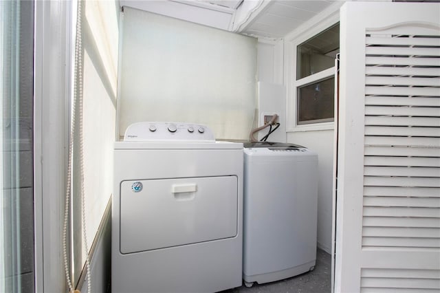 washroom featuring laundry area and washer and dryer