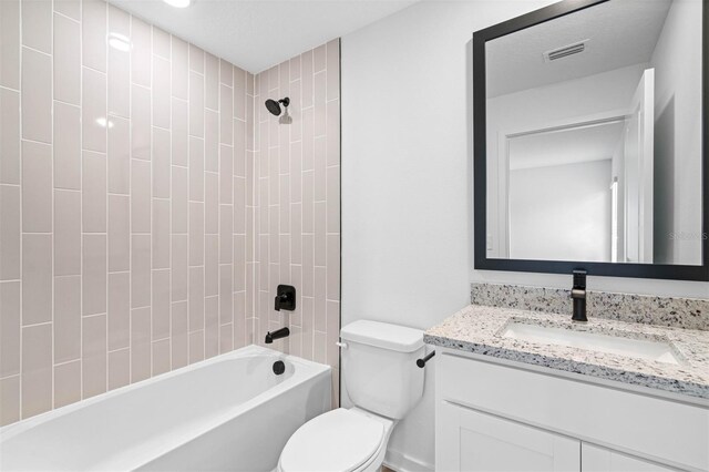 bathroom with visible vents, vanity, toilet, and shower / bathtub combination