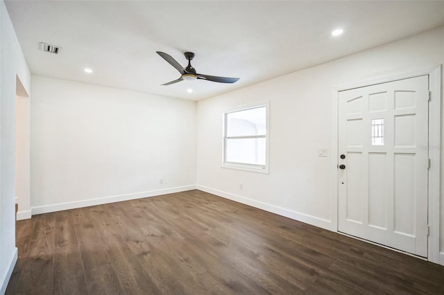 foyer with baseboards, visible vents, dark wood-style flooring, and ceiling fan