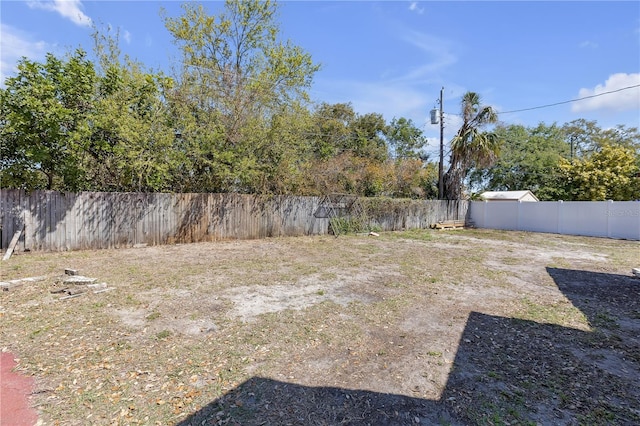 view of yard with a fenced backyard