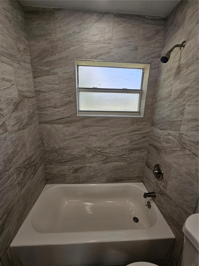 full bath with toilet and washtub / shower combination