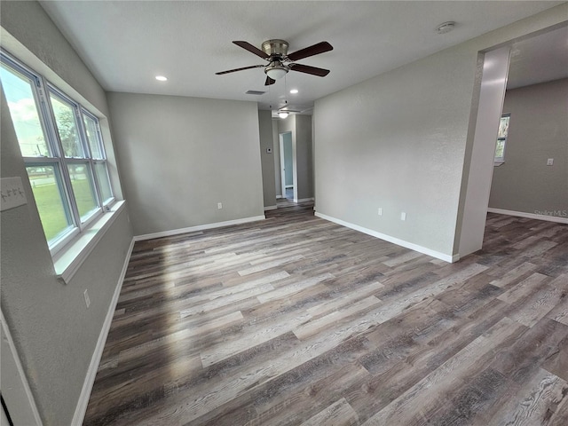 unfurnished room featuring recessed lighting, baseboards, a ceiling fan, and wood finished floors