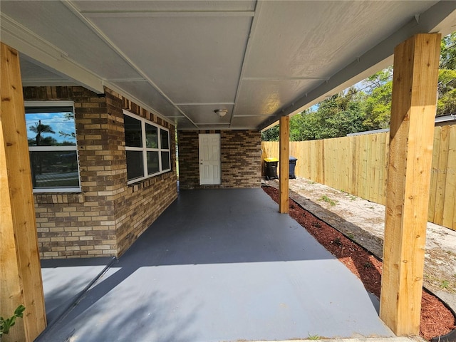 view of patio / terrace featuring fence