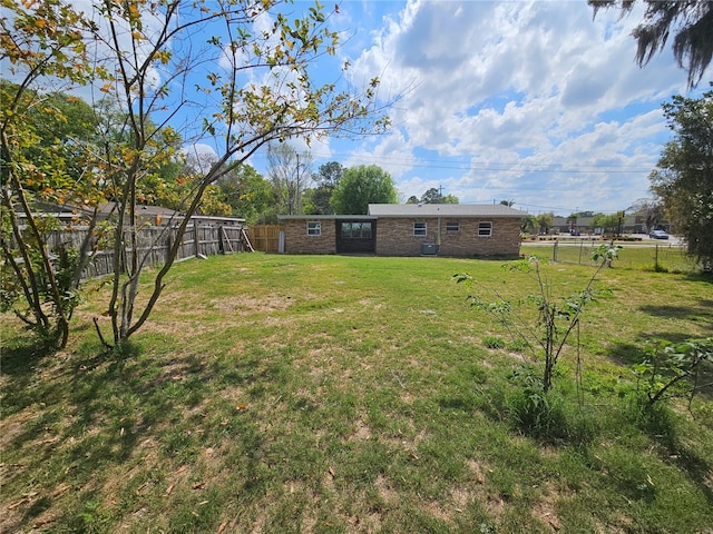 view of yard with a fenced backyard