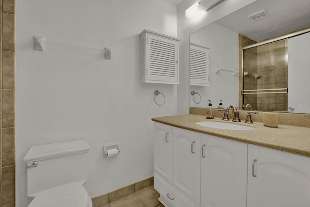 full bath with vanity, visible vents, a tile shower, tile patterned floors, and toilet