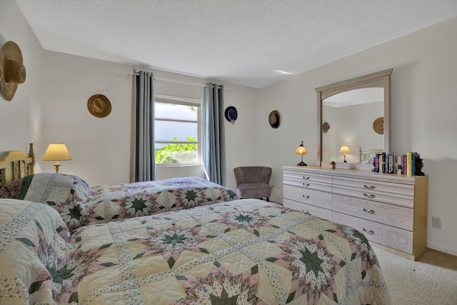 carpeted bedroom with a textured ceiling