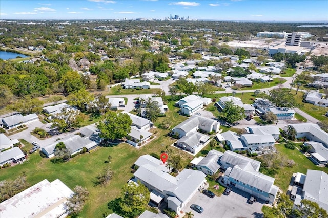 birds eye view of property with a water view and a residential view