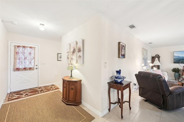entrance foyer featuring visible vents, baseboards, and light tile patterned flooring