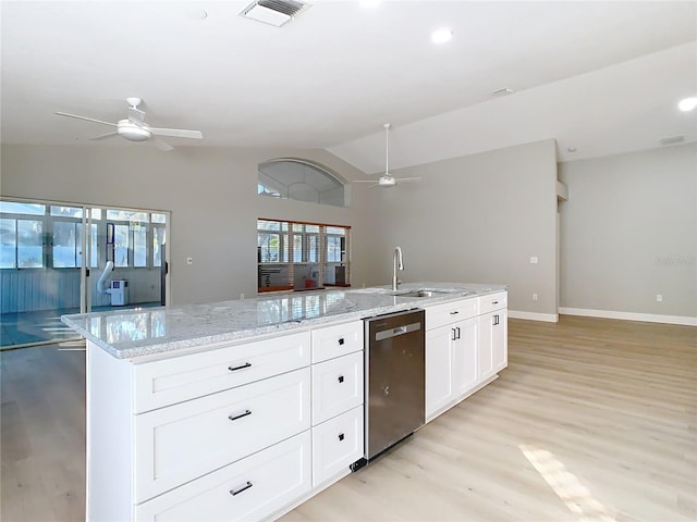 kitchen with a sink, open floor plan, dishwasher, and ceiling fan