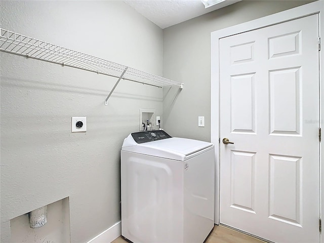 washroom with laundry area, washer / clothes dryer, and light wood-type flooring