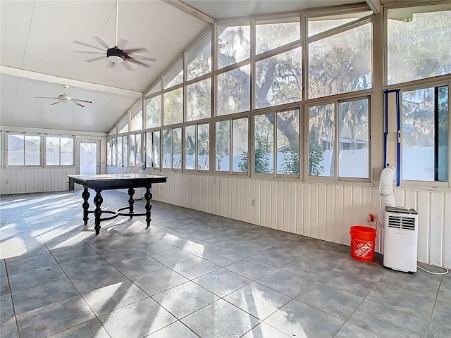 sunroom / solarium with lofted ceiling with beams and ceiling fan