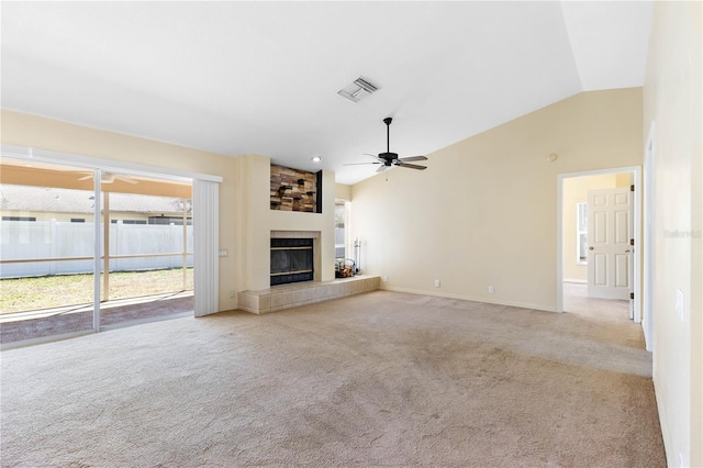 unfurnished living room featuring visible vents, carpet, a fireplace, ceiling fan, and vaulted ceiling