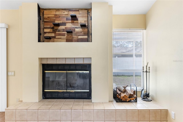 room details featuring a tile fireplace