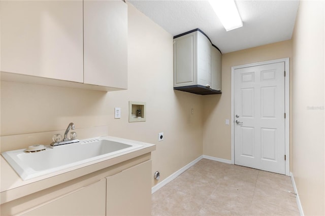 laundry area with hookup for a washing machine, baseboards, cabinet space, a sink, and electric dryer hookup