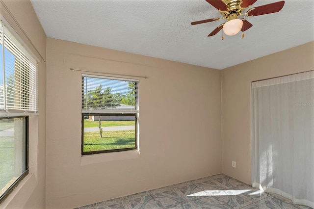 spare room with a textured ceiling