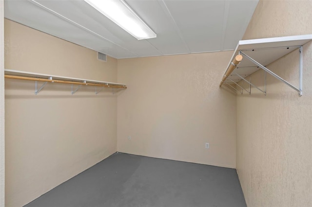 spacious closet featuring visible vents