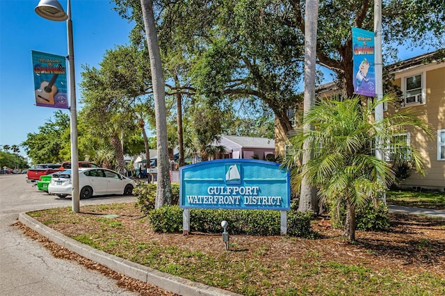 community sign with uncovered parking