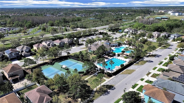 bird's eye view featuring a residential view and a view of trees