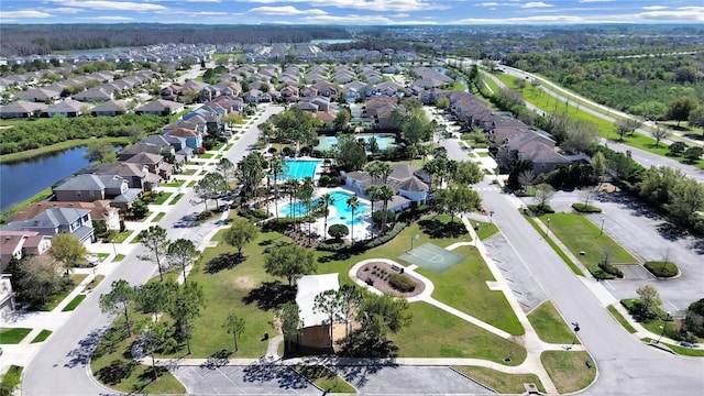 bird's eye view with a residential view and a water view