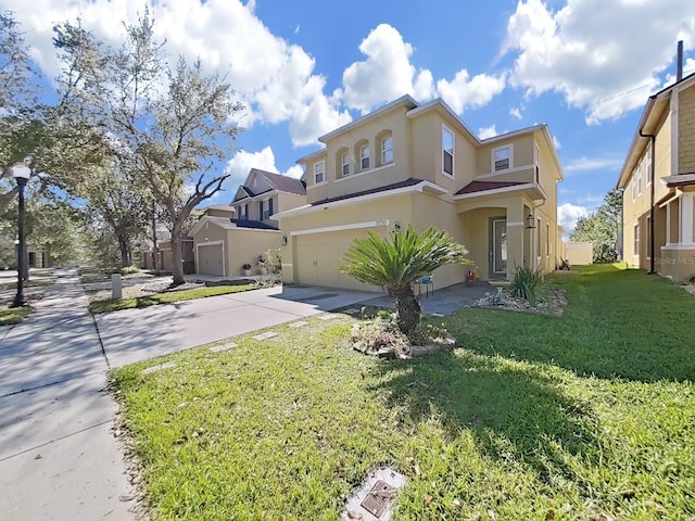 view of front of home with stucco siding, driveway, a front yard, and a garage