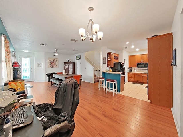 interior space featuring light wood-type flooring, stairway, visible vents, and recessed lighting