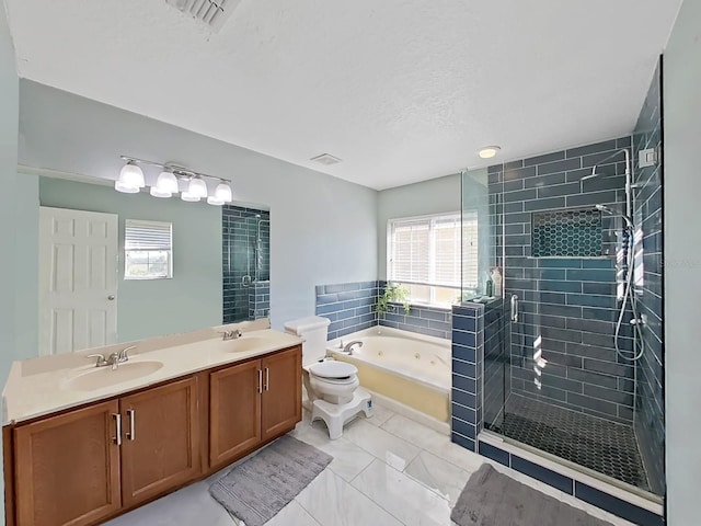 bathroom featuring double vanity, a tub with jets, a stall shower, and a sink