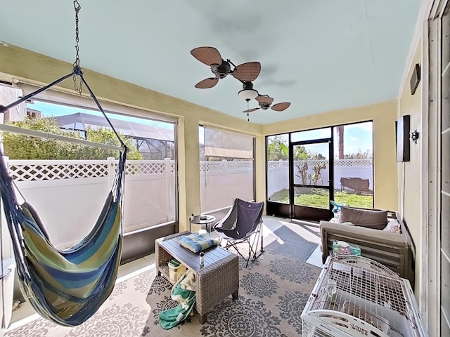 sunroom with a ceiling fan