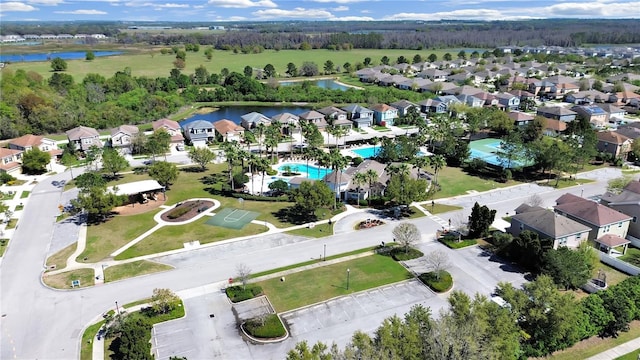 bird's eye view featuring a water view and a residential view