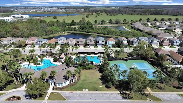 birds eye view of property featuring a residential view and a water view