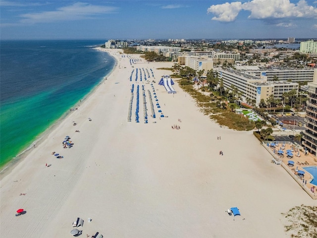 birds eye view of property with a city view, a view of the beach, and a water view