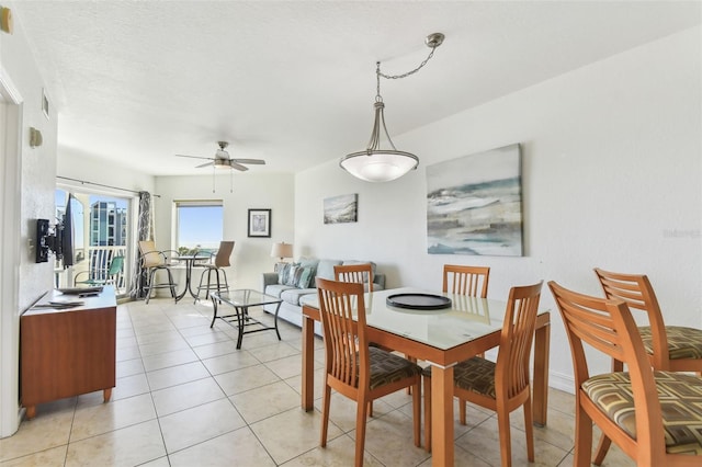 dining room featuring light tile patterned flooring, a ceiling fan, and visible vents