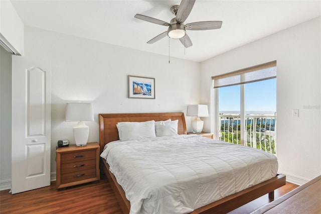 bedroom featuring dark wood finished floors, access to outside, a ceiling fan, and baseboards