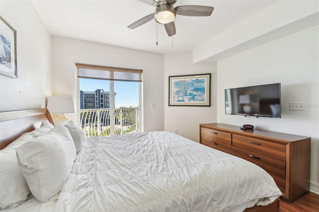 bedroom with a ceiling fan, access to exterior, and wood finished floors