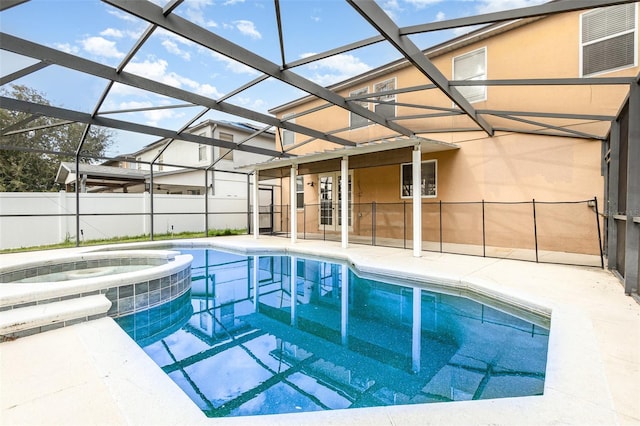 view of swimming pool with a pool with connected hot tub, fence, a lanai, central AC unit, and a patio