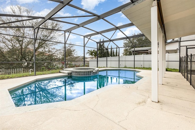 view of swimming pool featuring a pool with connected hot tub, fence, cooling unit, a lanai, and a patio area