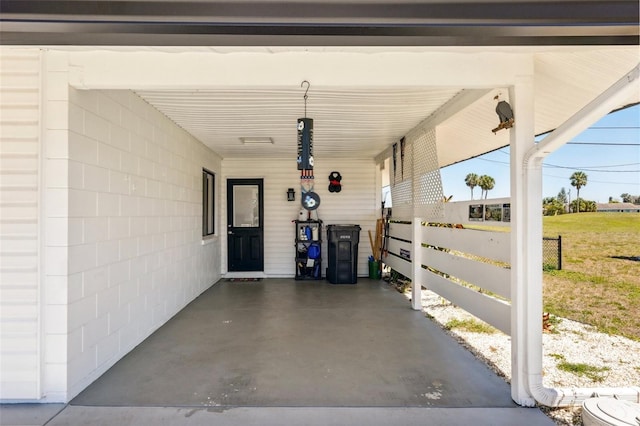 1021 Augusta Dr, Sun City Center, FL 33573 - view of patio featuring an attached carport