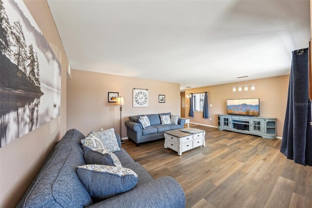 1021 Augusta Dr, Sun City Center, FL 33573 - living area with wood finished floors and baseboards