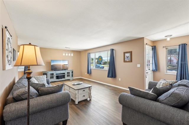1021 Augusta Dr, Sun City Center, FL 33573 - living area with baseboards and dark wood-type flooring