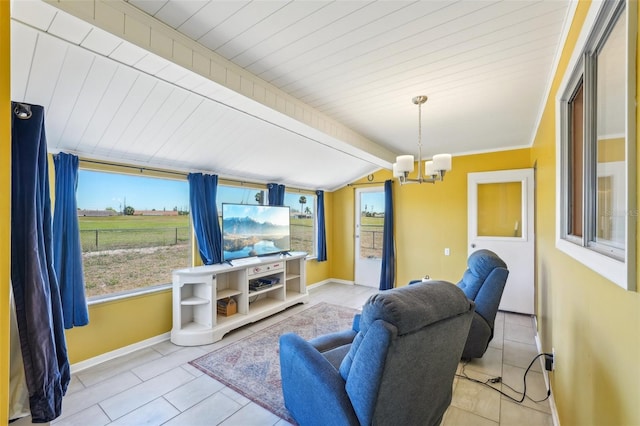 1021 Augusta Dr, Sun City Center, FL 33573 - tiled living room featuring plenty of natural light, baseboards, vaulted ceiling with beams, and a chandelier