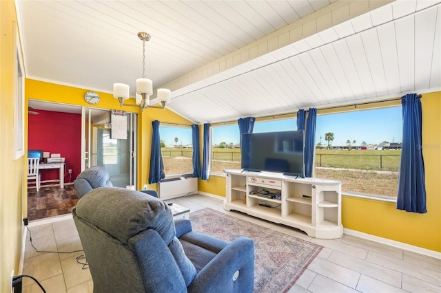 1021 Augusta Dr, Sun City Center, FL 33573 - living area featuring baseboards, plenty of natural light, a notable chandelier, and tile patterned flooring