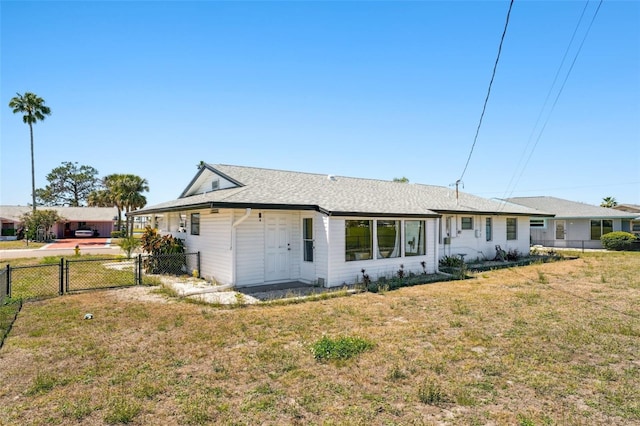 1021 Augusta Dr, Sun City Center, FL 33573 - view of front of house featuring a front yard and fence