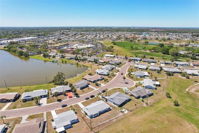 1021 Augusta Dr, Sun City Center, FL 33573 - drone / aerial view featuring a residential view and a water view