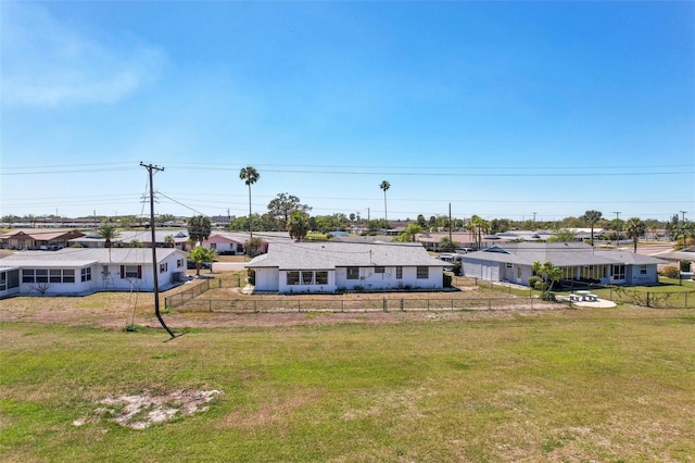 1021 Augusta Dr, Sun City Center, FL 33573 - exterior space with a lawn, fence, and a residential view