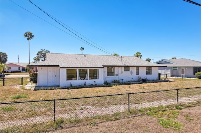 1021 Augusta Dr, Sun City Center, FL 33573 - ranch-style house with a front yard and a fenced backyard