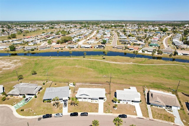 1021 Augusta Dr, Sun City Center, FL 33573 - drone / aerial view with a residential view and a water view