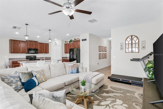 living room with light tile patterned floors, visible vents, recessed lighting, and ceiling fan