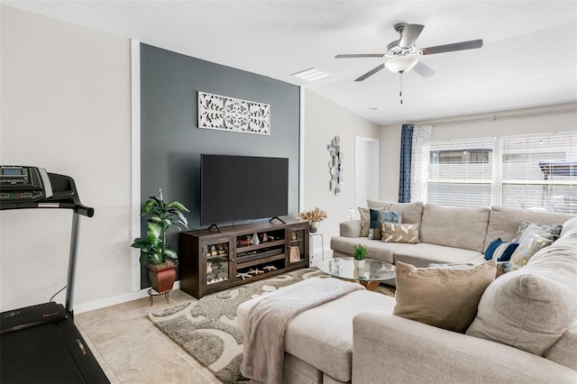 10105 Paradise Fish Dr, Riverview, FL 33578 - living room with tile patterned floors, visible vents, baseboards, and ceiling fan