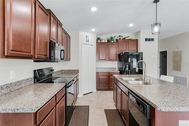 10105 Paradise Fish Dr, Riverview, FL 33578 - kitchen with visible vents, black appliances, pendant lighting, a sink, and recessed lighting